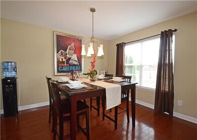 OPEN AND BRIGHT FORMAL DINING WITH NEUTRAL PAINT, HARDWOOD FLOORING, AND UPGRADED DROP FIXTURE! 201 NASHUA COURT, MURFREESBORO, TN 37128
