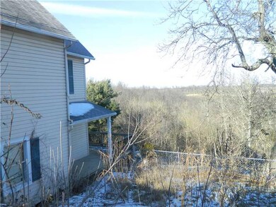 Exterior Front. View of side of home from street.
