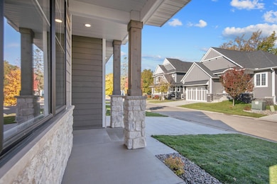 Relax and enjoy the beautiful neighborhood from your front porch.