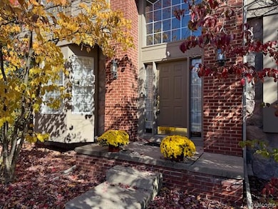 View of exterior entry with brick siding