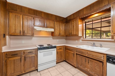 Over sink window looks out to side yard!