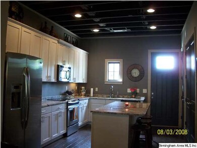 ANOTHER VIEW OF THE KITCHEN SHOWING WINDOW OVER SI
