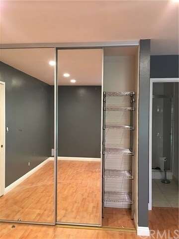 all closets have mirrored sliding doors and storag