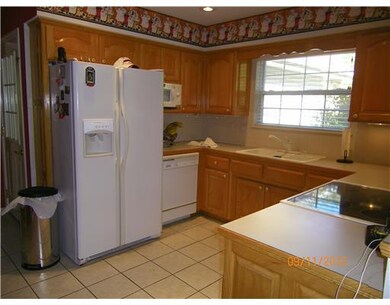Cafeteria/Kitchen. All appliances stay...including microwave/toaster unit