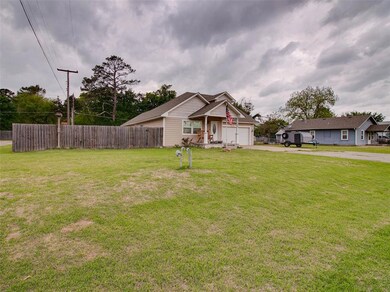 View of front of property featuring a garage and a