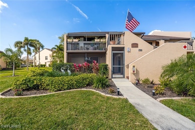 View of front facade with a front lawn and a balco