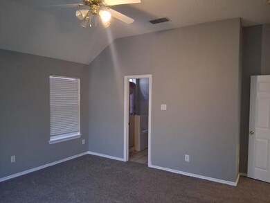 Unfurnished bedroom with visible vents, carpet flo