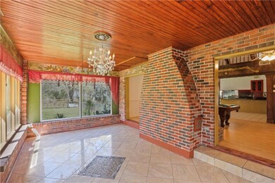 The sunroom steals the show! Gorgeous backyard vie