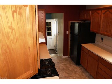 a nice galley style kitchen with all appliances in