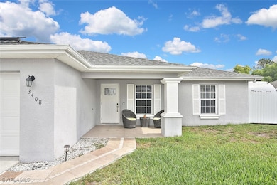 View of exterior entry featuring stucco siding, a
