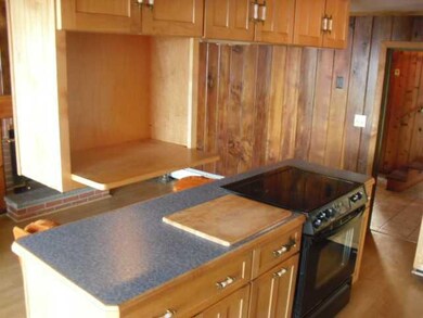 Exterior Front kitchen isalnd has built in miscorw