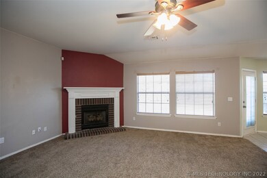 Large windows overlook large lovely backyard and p