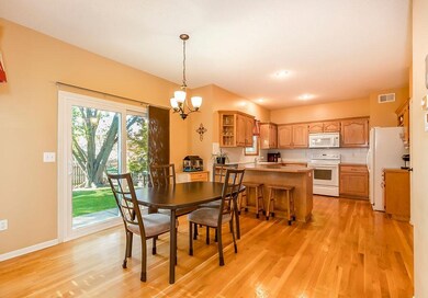 Large kitchen with breakfast bar and dining area. 