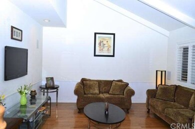 FORMAL LIVING ROOM HAS VAULTED CEILINGS AND PLANTA