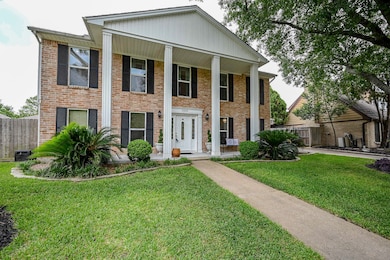 Colonial home with columns and beautiful curb appe