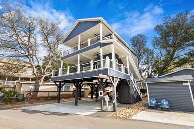 View of front facade featuring a ceiling fan and a balcony