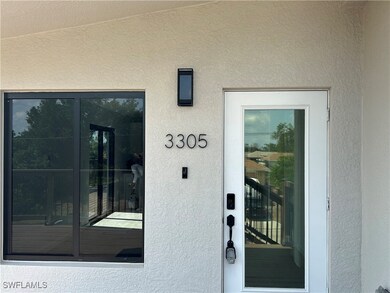 Entrance to property with stucco siding