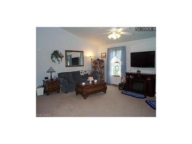 Great room w/ vaulted ceiling.