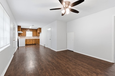 Open concept family room, dining area, and kitchen.