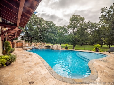 The backyard boasts an incredible, large pool and hot tub for all of your outdoor entertaining and summer fun!