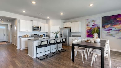 Kitchen featuring stainless steel appliances, whit