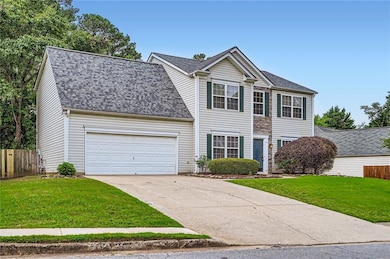 Traditional-style home with concrete driveway, an 