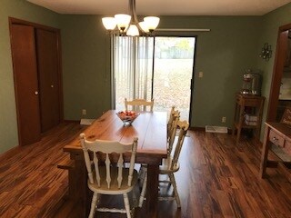 Spacious Dining Room has Patio Doors to Backyard