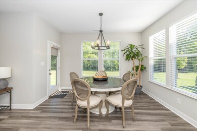 Breakfast nook leads to back patio.