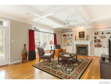 Family Room with beam-box ceiling, gas fireplace a