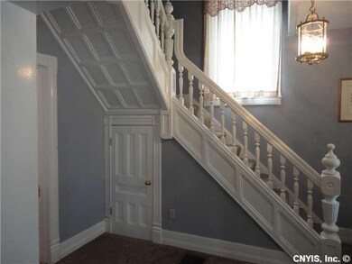 Foyer. Foyer with open stairway leading to 4 bedro