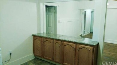 From kitchen in front house looking toward living 