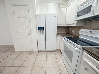 The kitchen boasts ample countertop and storage space for meal prep, cooking and all your culinary functionality needs.