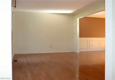 Spare room with wood-type flooring