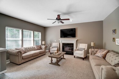 Love the White Fireplace Mantel and all the Natural Light...