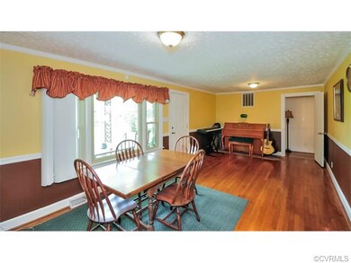 The Great Room features hardwood floors, crown mou