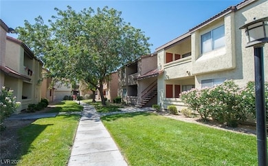 View of property's community with a yard