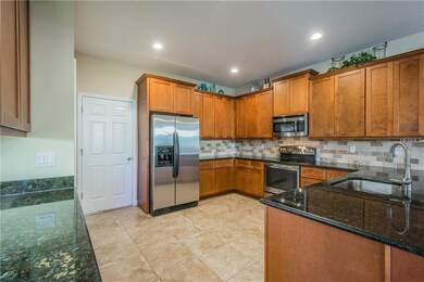 42 inch wood cabinets with granite counters and SS