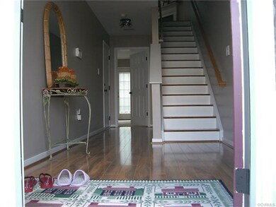 Entrance  with gorgers hard wood floor and stair