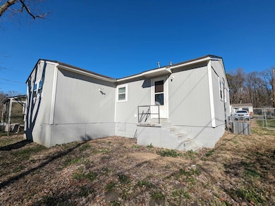 Back of house featuring crawl space