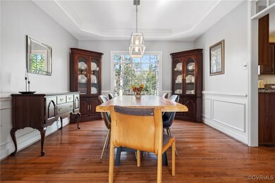 Dining area with a wainscoted wall, ornamental mol
