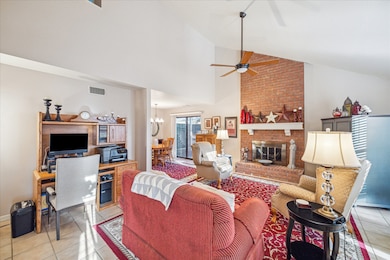 Large living room with wood burning fireplace and