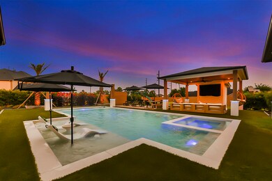 A serene view showcases the lush synthetic grass surrounding the pool area, providing a vibrant and low-maintenance landscape. This synthetic grass adds a touch of natural beauty while ensuring durability and ease of upkeep, creating a welcoming and inviting space for outdoor recreation and relaxation.