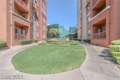 View of property's community featuring a lawn and