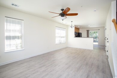 Unfurnished living room with light wood finished floors, ceiling fan, and recessed lighting