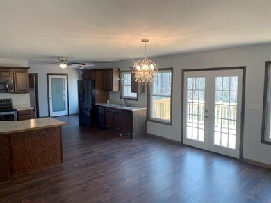 Open floor plan with separate laundry room, pantry