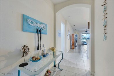 Hall featuring light tile patterned floors