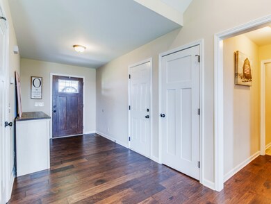 Only home in Richland Farms with an entry foyer! Coat closet and garage doors conveniently located here. Hallway to master suite and laundry room