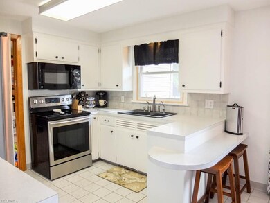 Updated kitchen with a breakfast bar.