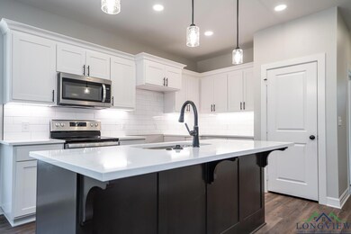 Kitchen featuring appliances with stainless steel 