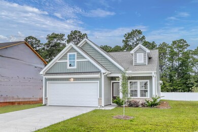 View of front of property featuring a garage and a